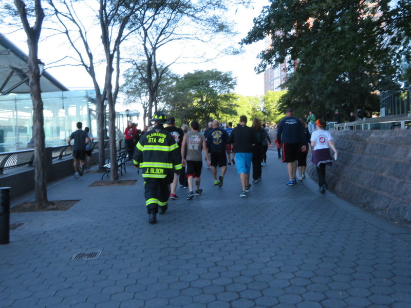 Many firemen in full dress were participating in the run